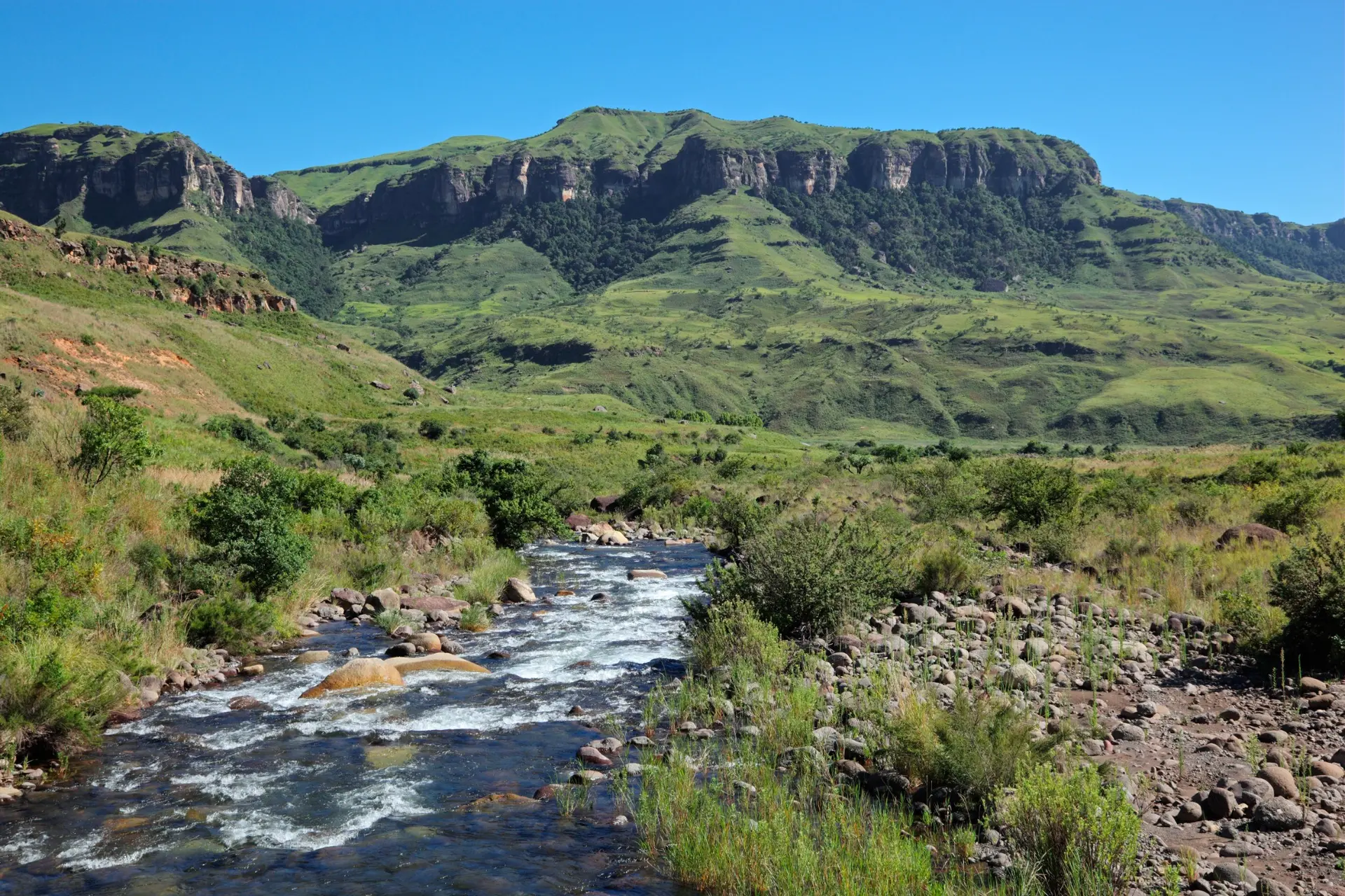 Mountain landscape and flowing river in the Drakensberg, South Africa